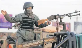  ?? REUTERS/FILE ?? ■ An Afghan policeman keeps watch at the site of an attack in Kabul. over 65% of the population but only 55.5% of Afghanista­n’s 407 districts.