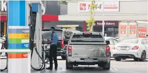  ?? PORNPROM SATRABHAYA ?? A pickup refuels at a PTT station in Bangkok. The government recently decided to cut the excise tax on diesel by 5 baht per litre from May 21 to July 20.