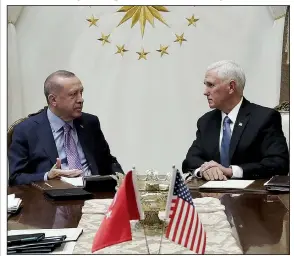  ?? AP/Presidenti­al Press Service ?? Turkish President Recep Tayyip Erdogan (left) and Vice President Mike Pence hold talks Thursday at the Presidenti­al Palace in Ankara before Pence announced the cease-fire agreement and plans for Kurdish fighters to withdraw from northern Syria.