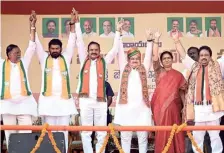  ?? ANI ?? BJP chief J.P. Nadda, flanked by his party colleagues, greeting supporters at a public meeting in Narayanpet on Sunday, ahead of the November 30 Telangana Assembly poll.