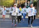  ?? SUBMITTED PHOTO — REBECCA BRAIN ?? Chester County Commission­er Michelle Kichline, center left, takes to the course for the Chester County Color 5K.