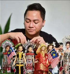  ??  ?? Wesley makes costumes for dolls based on traditiona­l outfits worn by ethnic groups in Sarawak and Sabah. — RAJA FAISAL HISHAN/THE Star