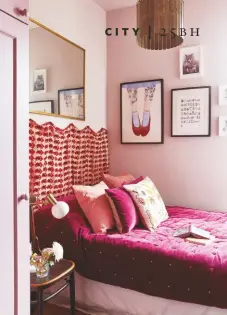  ??  ?? BEDROOM This hard-working room, the site of the original kitchen, now serves as a guest room-cum-office as well as harbouring a concealed utility.
The wall-hung fabric was sourced in Jaipur. Molly Mahon’s Buti in Pink, £45m, is similar