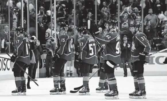  ?? Andy Cross, The Denver Post ?? Avalanche players skate off the ice after losing their opening-round series to the Predators last weekend at the Pepsi Center.