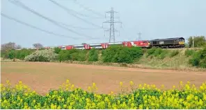  ?? CHRIS BOOTH ?? GBRf No. 66779 brought No. 91116 and a Mk4 rake to Doncaster on April 10 and then took the carriages via the South Yorkshire Joint Line to Worksop for storage. The train is seen passing Tickhill.