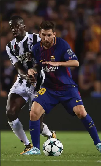  ??  ?? Lionel Messi of Barcelona competes for the ball with Blaise Matuidi of Juventus during their UEFA Champions League Group D match at Camp Nou.