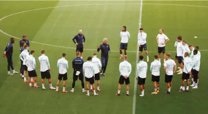  ??  ?? Switzerlan­d's head coach Vladimir Petkovic, center, gives instructio­ns to his team during a training session ahead of the game against Ukraine at the Arena Lviv stadium in Lviv, Ukraine