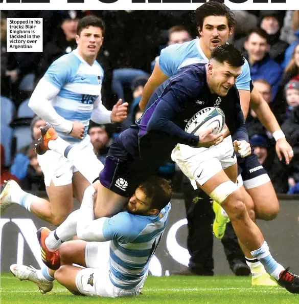  ??  ?? Stopped in his tracks: Blair Kinghorn is tackled in the victory over Argentina