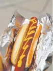  ??  ?? Watkins has raised the cost of a dog just 50 cents since 1995. It is $2 for a hot dog and $4 for a brat, with combos available.