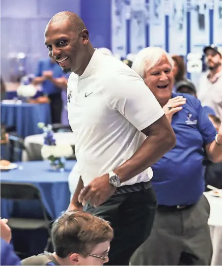  ??  ?? Fans applaud Penny Hardaway as he takes the stage during the Memphis Rebounders annual preseason banquet at the Laurie-Walton Family Basketball Center on Tuesday. BRAD VEST/THE COMMERCIAL APPEAL,