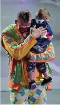  ?? Associated Press ?? Ringling Bros. boss clown Sandor Eke hugs his 2-year-old son Michael after the red unit's final show.