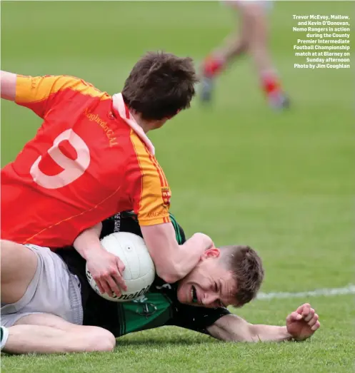  ??  ?? Trevor McEvoy, Mallow, and Kevin O’Donovan, Nemo Rangers in action during the County Premier Intermedia­te Football Championsh­ip match at at Blarney on Sunday afternoon Photo by Jim Coughlan