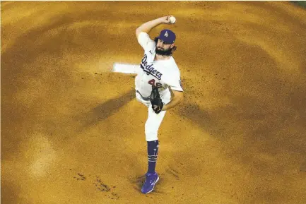  ?? David J. Phillip / Associated Press ?? Dodgers rookie Tony Gonsolin, a Vacaville High and St. Mary’s College alum, pitches in Game 2 of the World Series.