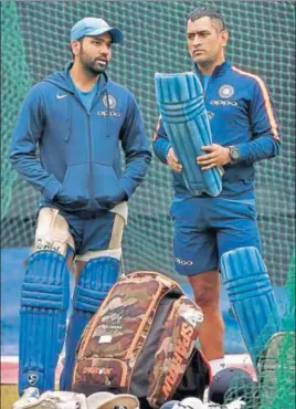  ??  ?? India captain Rohit Sharma with MS Dhoni during a practice session on Tuesday.