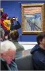  ?? HEIKO JUNGE/NTB SCANPIX VIA AP, FILE ?? People look at Edvard Munch’s “The Scream” at the National Gallery in Oslo, Norway, in 2019.