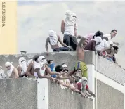  ??  ?? LEFT
Inmates during a riot in Caracas, Venezuela, late last month.