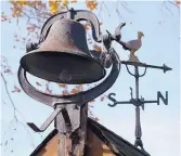  ?? GREG SORBER/JOURNAL ?? A bell and weathervan­e sit on top of the old pump house at the Historic Yott house on 12th Street.