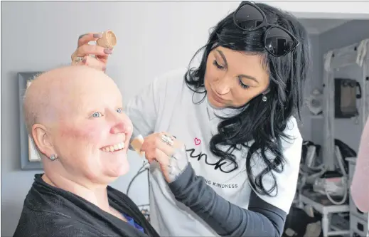  ?? JUANITA MERCER/THE TELEGRAM ?? Kerry Churchill has her makeup applied by Dana Metcalfe for the 2019 Breastless and Beautiful calendar photo shoot on Sunday.