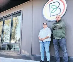  ??  ?? Councillor Sandra Joe and adviser Darwin Douglas stand outside the cannabis retail store licensed by the KwawKwaw-Apilt First Nation near Chilliwack.