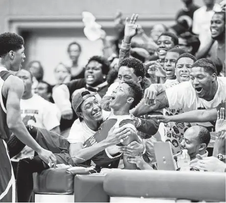  ?? Craig H. Hartley ?? Brandon Green and the North Shore fans have reason to be jubilant, as the Mustangs are headed to the state basketball tournament for the first time sine 1997 after beating Fort Bend Bush in the Class 5A Region III final.