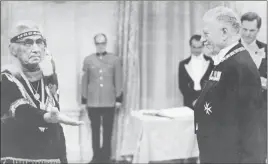  ?? CP PHOTO ?? Chief Dan George puts his hand out to receive the medal of the Order of Canada from Gov.-Gen. Roland Michener during a ceremony in Ottawa on Oct. 30, 1971.