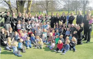  ??  ?? Staff and kids at Scamps Day Nursery celebrate the top spot