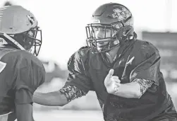  ?? ALEX GOULD/THE REPUBLIC ?? Mesa linebacker Mcky Peters practices breaking through a teams offensive line during morning practice on Monfay.