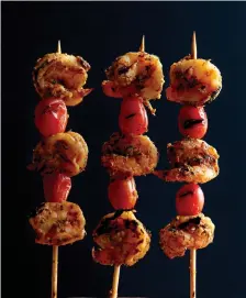  ?? Tribune News Service ?? ■ Spiced Shrimp and Tomato Kebabs.