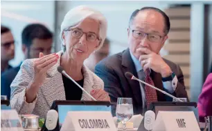  ?? — AFP ?? IMF chief Christine Lagarde and World Bank President Jim Yong Kim at the IMF/WB Spring meetings in Washington, DC. The IMF raised its forecast for global growth to 3.5 per cent this year.