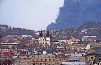  ?? NARIMAN EL-MOFTY ?? Smoke fills the sky above Lviv, western Ukraine, yesterday