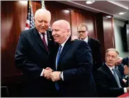  ?? J. SCOTT APPLEWHITE AP PHOTO BY ?? House Ways and Means Committee Chairman Kevin Brady, R-texas, center, embraces Senate Finance Committee Chairman Orrin Hatch, R-utah, left, as House and Senate conferees after GOP leaders announced they have forged an agreement on a sweeping overhaul...