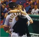  ??  ?? Mike Yastrzemsk­i hugs his mother, Anne Marie, before the Giants play the Red Sox at Fenway Park in September 2019. Anne Marie has always been his pillar of support.