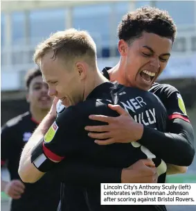  ??  ?? Lincoln City’s Anthony Scully (left) celebrates with Brennan Johnson after scoring against Bristol Rovers.