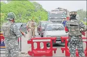  ?? PTI ?? ■
Security personnel check vehicles on the Jammu-Srinagar national highway ahead of the Amarnath yatra in Jammu on Friday.