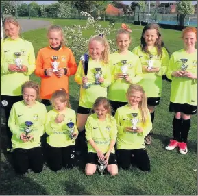  ??  ?? The Green Towers Club 4 Young People Under-10s girls futsal team gathered trophies galore during their debut season as part of the club’s GreenTower­s FC outfit