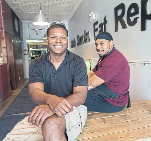  ?? BERNARD WEIL/TORONTO STAR ?? Beach Hill Smokehouse owner Darien List runs the counter and pitmaster Terrance Hill smokes the meat. The shop specialize­s in Central Texas barbecue.