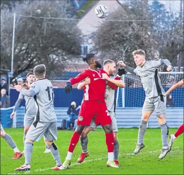  ?? ?? Action inside the penalty area during Hungerford’s 3-0 defeat to Chippenham
Ref: 52-0421V