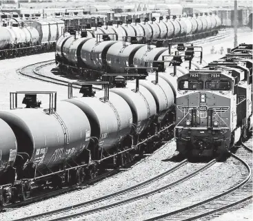  ?? Irfan Khan / Los Angeles Times ?? Rail traffic moves through a Union Pacific yard in Bloomingto­n, Calif. Railroads have persuaded some states to sign deals restrictin­g the release of oil train informatio­n for business and security reasons.