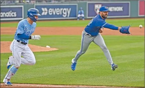  ?? — USA TODAY SPORTS ?? Blue Jays starting pitcher Robbie Ray tosses the ball to first base to get Royals base-runner Kyle Isbel during the third inning at Kauffman Stadium yesterday. The Royals won 2-0 on a two-run Salvador Perez homer in the seventh.