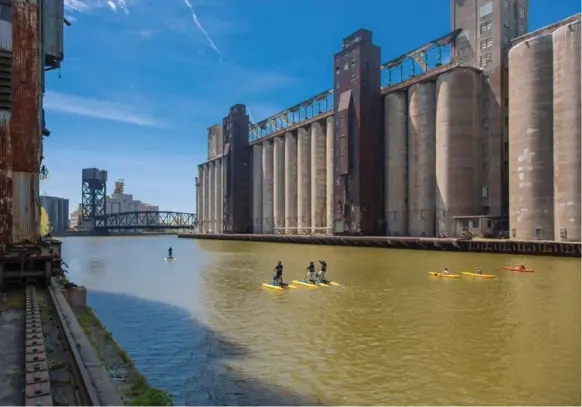 ?? JIM SCHWABEL ?? You can rent water bikes or kayaks to explore Buffalo’s booming waterfront and the area known as Silo City. Multimilli­on-dollar redevelopm­ent aims to turn the space into an arts hub.
