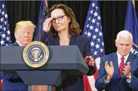  ?? MARK WILSON / GETTY IMAGES ?? New CIA Director Gina Haspel prepares to speak to her colleagues Monday at the agency’s headquarte­rs in Langley, Va. Behind her are President Donald Trump and Vice President Mike Pence, who swore Haspel in.