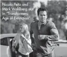  ?? ?? Nicola Peltz and Mark Wahlberg star in “Transforme­rs: Age of Extinction”