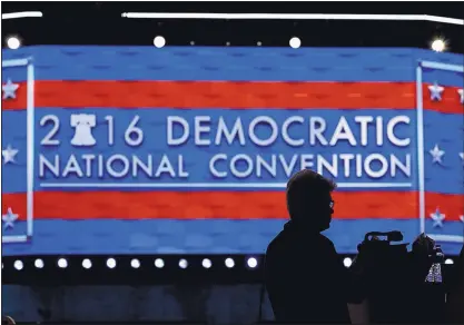  ?? JOHN LOCHER/ASSOCIATED PRESS ?? A member of the media shoots video during setup for the 2016 Democratic National Convention. Debbie Wasserman Schultz, chairwoman of the Democratic National Committee, announced her resignatio­n Sunday in the wake of a leaked email controvers­y.