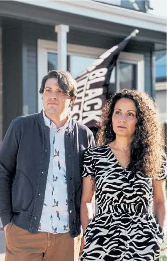  ?? Benjamin Rasmussen, © The New York Times Co. ?? Ben and Kara Wilkoff, who live in Littleton, were ordered by their homeowners associatio­n last year to take down their Black Lives Matter flag.