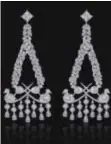  ??  ?? CHANDELIER EARRINGS
With bird detailing and droplet tassels featured on E! Live, from the red carpet Oscars pre-show in 2016