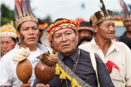  ?? Photograph: Evaristo Sa/AFP via Getty Images ?? Indigenous people of the Guarani-Kaiowá tribe protest in Brasília, Brazil, on 17 May 2016.