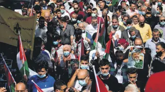  ??  ?? Palestinia­ns gather to commemorat­e the second intifada and protest the Israeli normalizat­ion deals, occupied West Bank, Palestine, Sept. 27, 2020.