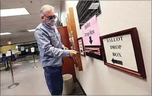  ?? ALEX HORVATH / THE CALIFORNIA­N ?? Armando Hernandez brought his ballot inside the Kern County Elections Division at 1115 Truxtun Ave. on Thursday morning.