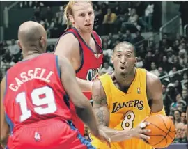  ?? Lisa Blumenfeld Getty Images ?? THE CLIPPERS THOUGHT they had Kobe Bryant in 2004, but then Jerry Buss stepped in and Bryant signed a seven-year, $136-million deal with the Lakers.