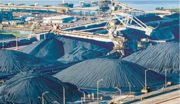  ?? JERRY JACKSON/STAFF ?? Piles of coal are seen at Consol Marine Terminal in Canton. The coal cannot be exported until the shipping channel is cleared following the collapse of the Francis Scott Key Bridge.